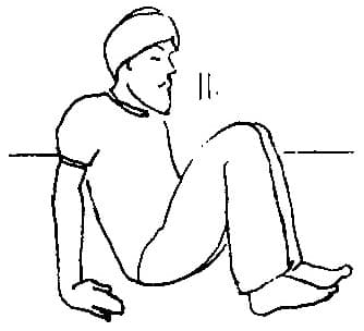 11. Remain in the seated position with the knees drawn into the chest.